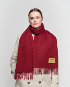 A cinematic flat-lay of Scott Cashmere scarves in elegant gift boxes ready for Mother’s Day.